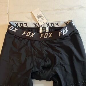 Fox racing black one piece under wear with build in socks.  New!